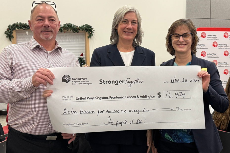 people holding cheque